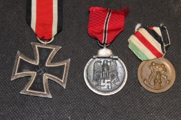 A collection of Third Reich Awards and Badges, comprising, various War Merit crosses, Italian Africa