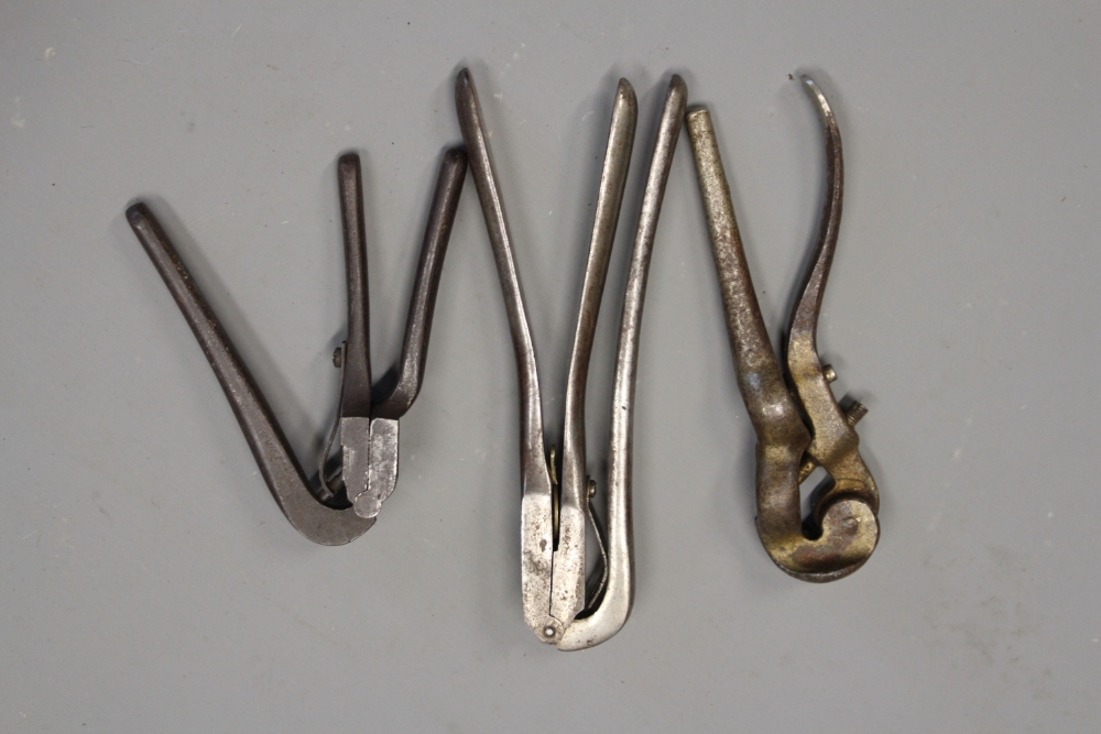 Three various steel cappers.