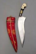 An ivory hilted Indian dagger, 23cm sharply curved T-section blade, brass wood and ivory sectional