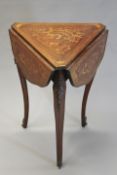 A late 19th Century marquetry inlaid occasional table in Louis XV style, with ormolu mounts and