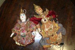 Two vintage Eastern puppets in gilt embroidered and studded bead costume.