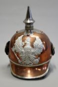 A Prussian style Guard de Corps helmet, copper skull with white metal trim, silver painted copper