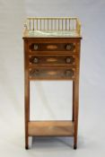 A Regency mahogany and inlaid gallery top stand with marble inset above three drawers and lower