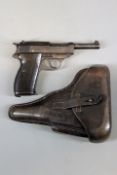 A de-activated Third Reich Walther P-38 semi-auctomatic pistol and holster, serial no. 3050L,
