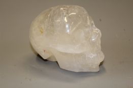 An interesting carved rock crystal skull, 12cm high.