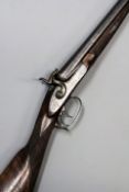 A double barrelled 12-bore bar in wood gun by Turner, 30inch sighted barrels, border and scroll