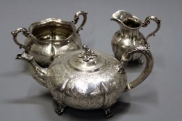 An early Victorian silver three piece tea service, London 1840 and 1841 by Robert Hennell, of