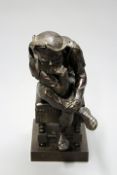 A late 19th/early 20th Century bronze figure of the court jester Triboulet seated in contemplative