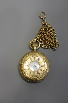 An 18ct gold ladies pocket watch, foliate engraved case marked 18K, suspended from an 18ct gold
