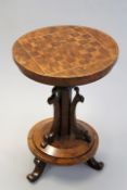 A 19th Century yew wood occasional table with inlaid chequerboard top, 48cm diameter.