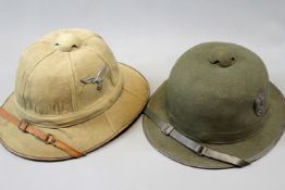 A Third Reich Luftwaffe pith helmet, applied with alloy eagle and national colours shield together