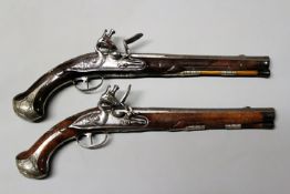 A fine pair of Continental silver mounted flintlock holster pistols, 10.75inch sighted, slightly