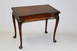 A George III and later mahogany centre table the moulded edge top on tapering legs and pad feet,
