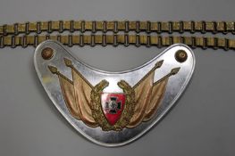 A Third Reich Veterans Gorget and Chains, the white metal backing plate applied with a brass stand