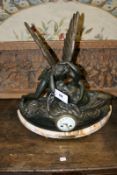 A 19th Century French mantel clock, the marble base surmounted with patinated spelter figure group