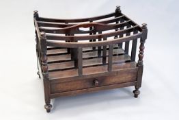 A late Regency mahogany Canterbury, the four division top with turned corner supports and base