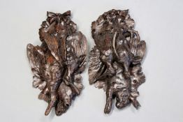 A brace of carved oak hanging game wall plaques, one depicting Duck, Snipe and fish, the other