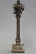 A silver Corinthian column oil lamp by Mappin & Webb, altered and converted for electricity.