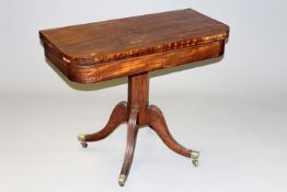 A Regency inlaid mahoganyD shaped card table on pedestal support and four reeded sabre legs, brass