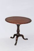 An 18th Century mahogany bird cage tilt top tripod table, 77cm diameter.