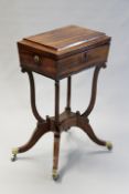 A Regency mahogany and inlaid tea poy, the interior fitted with four canisters and two mixing bowls,