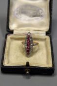 A French Art Deco style ruby and diamond set ring.