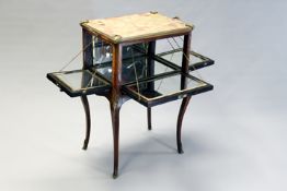 A 19th Century French inlaid kingwood and gilt bronze mounted cabinet, the four sides opening to