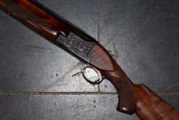 A Winchester 101 double barrelled 12bore over and under shotgun, 30inch barrels, border and scroll