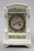 An Aesthetic movement pottery cased mantel clock with dome top and mistletoe decoration over all,