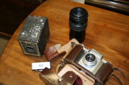 A Praktiflex camera, with a Carl Zeiss Tessar f3.5 50mm lens in meter`s case, together with a