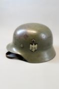 A Third Reich Army M35 double decal helmet, the parade finish light green steel skull with single