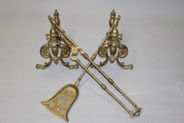 A set of Victorian brass fireside tools together with matching brass andirons (tongs 74cm).