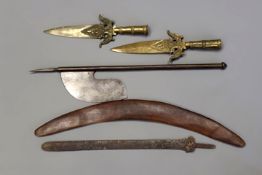 A pair of Indian bronze lance heads, decorated with scrolling foliage and flower heads at the fortes