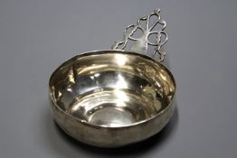 A late 18th/early 19th Century Colonial silver porringer with pierced handle, script monogram to