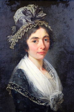 A 19th Century portrait of a young woman, in lace trimmed hat and lace collar, oil on canvas laid on