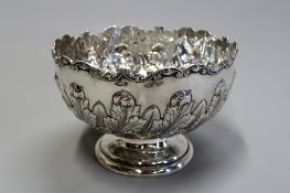 A large silver punch bowl, Birmingham 1901 (maker’s marks rubbed), with applied scroll edge and