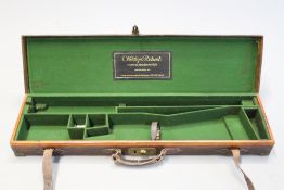 A Westley Richards sporting gun case, the brass bound leather covered body with green baize