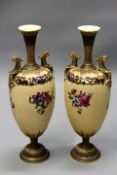 A pair of Royal Worcester urn form vases decorated with swags of flowers, puce Worcester mark and