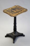 A Regency penwork decorated lamp table on turned and carved support and platform base, 71cm high.