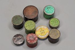 Nine various tins of percussion caps. (9)