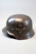 A Third Reich Luftwaffe M40 single decal helmet, the black/blue steel skull with single decal to