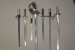 A 1912 pattern Cavalry Officer`s sword, by Wilkinson, together with six various bayonets, one with