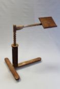 An Arts and Crafts walnut adjustable reading stand.