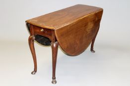 A George III carved mahogany dining table with shaped top above apron drawer on cabriole legs with