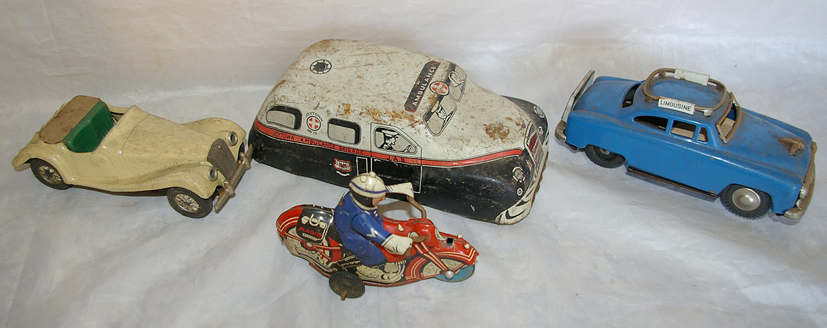 Tinplate selection of four vehicles to include: Scalex MG; Police Motorcycle and motorcyclist;