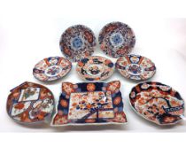 Two pairs of Imari Plates, each with hipped rims and decorated in traditional colours with
