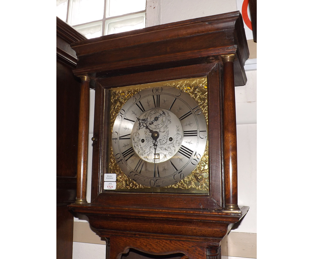 A late 18th Century Oak Long Case Clock with square base, applied with Brass Rococo spandrels,