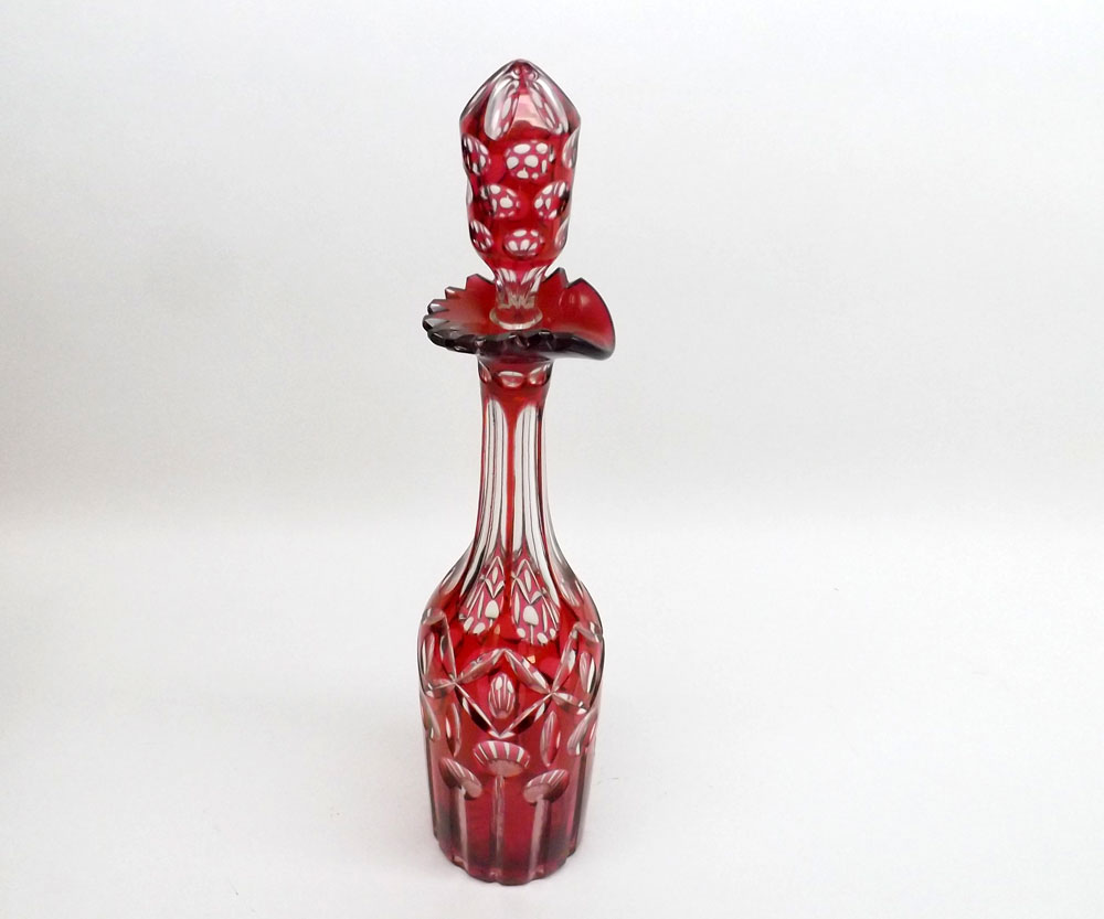 A late 19th/early 20th Century Cranberry and clear cut glass Decanter of tall narrow circular form,