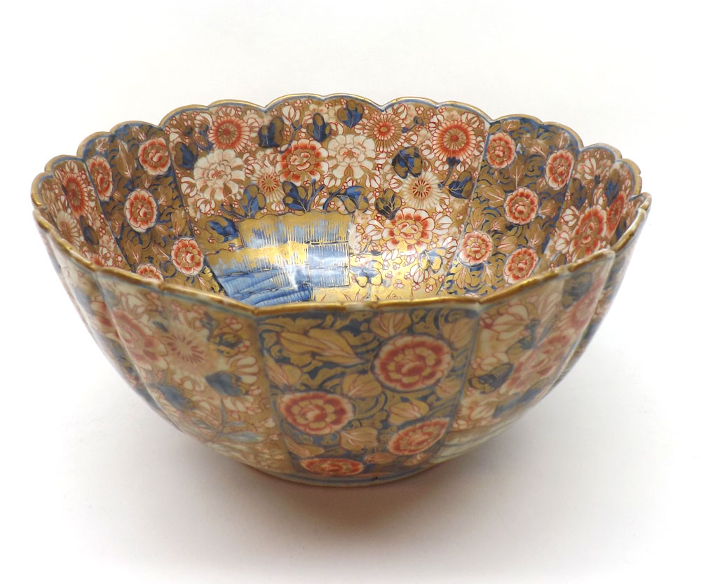 A Japanese Imari large circular Bowl of tapering form with a hipped rim, painted in traditional