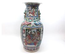 A 19th Century Canton large baluster Vase, the neck applied with temple dogs and lizards, the